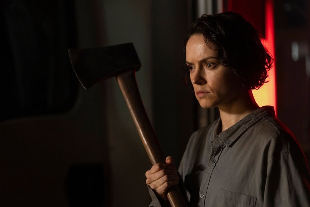 We Bury the Dead images feature Daisy Ridley, corpses, and an axe