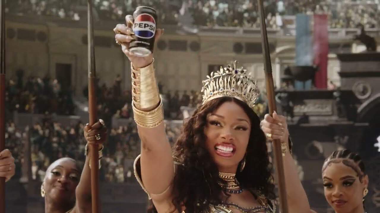 Gladiator II inspired Pepsi tie-in commercial for the NFL season drops online featuring Travis Kelce and Megan Thee Stallion